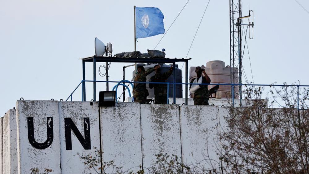 UN peacekeepers observe the border with Israel from an observation post in Marwahin, in southern Lebanon (12 October 2023)