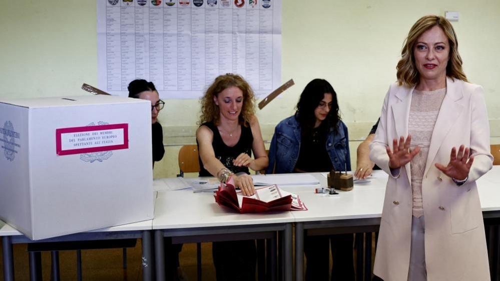 Italy's Prime Minister Giorgia Meloni gestures at the polling station on the day of the European parliamentary elections, in Rome, Italy June 8