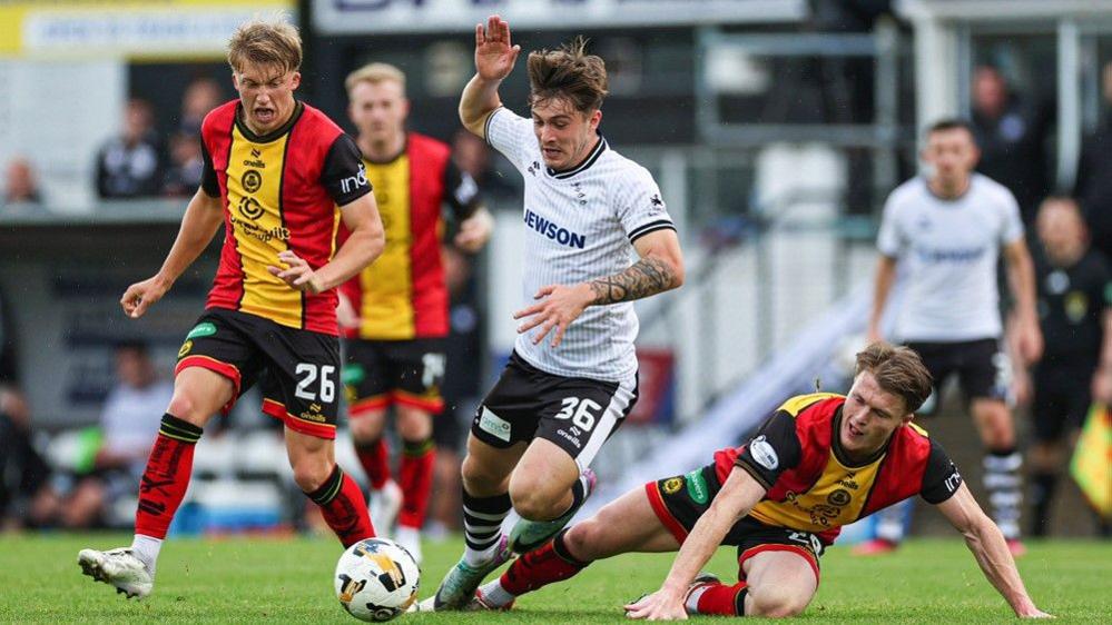 Ayr United's Alfie Bavidge with Partick Thistle's Luke McBeth