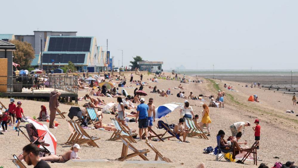 Wide angle shot of people enjoying the sunshine on Jubilee Beach in Southend
