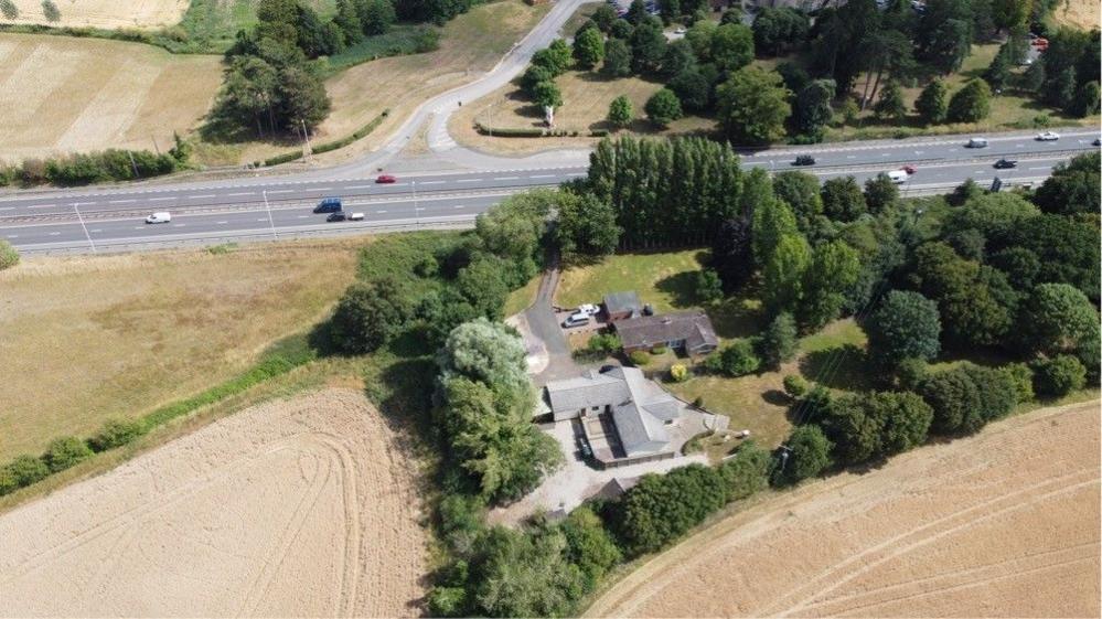 Aerial of home next to busy A road - the A12