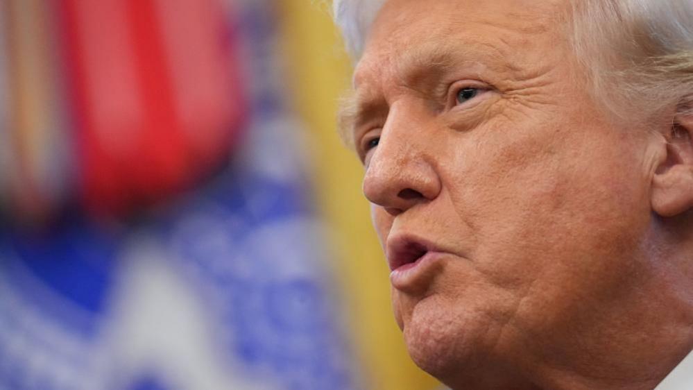 President Donald Trump speaks to reporters in the Oval Office of the White House on Monday