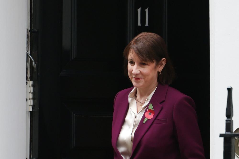 Chancellor Rachel Reeves seen talking out the door of Number 11 Downing Street