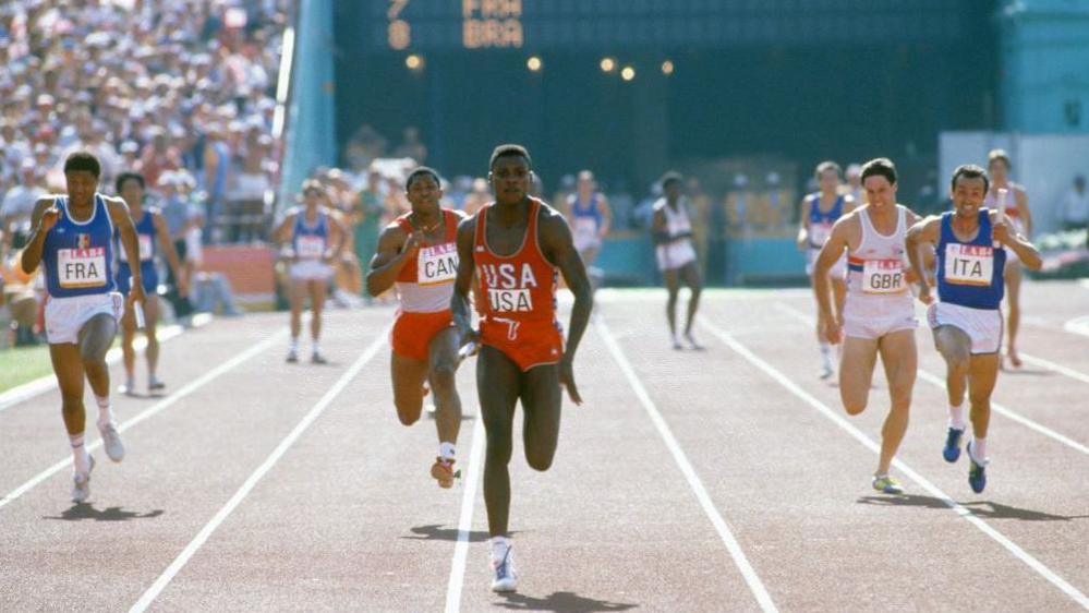 Carl Lewis  leads the 100m at the 1984 Olympics