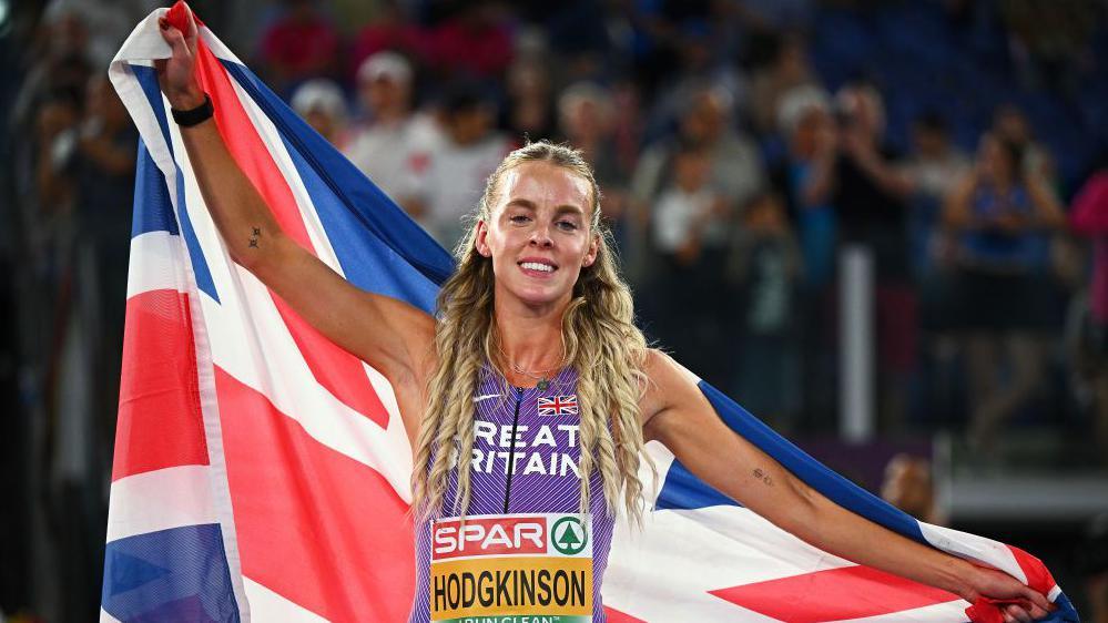 Keely Hodgkinson celebrates with the Union flag after winning European gold in June