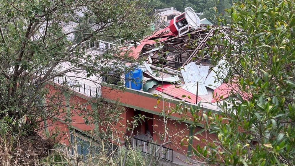 A pictures shows the top of Bilal Mosque collapsed after the strikes.
