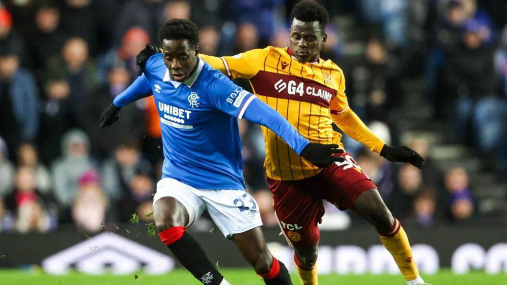 Djeidi Gassama and Motherwell's Ibrahim Said in action during a William Hill Premiership match between Rangers and Motherwell at Ibrox Stadium, on December 27, 2025