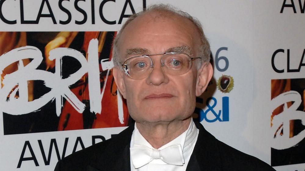 John Rutter wearing white bow tie