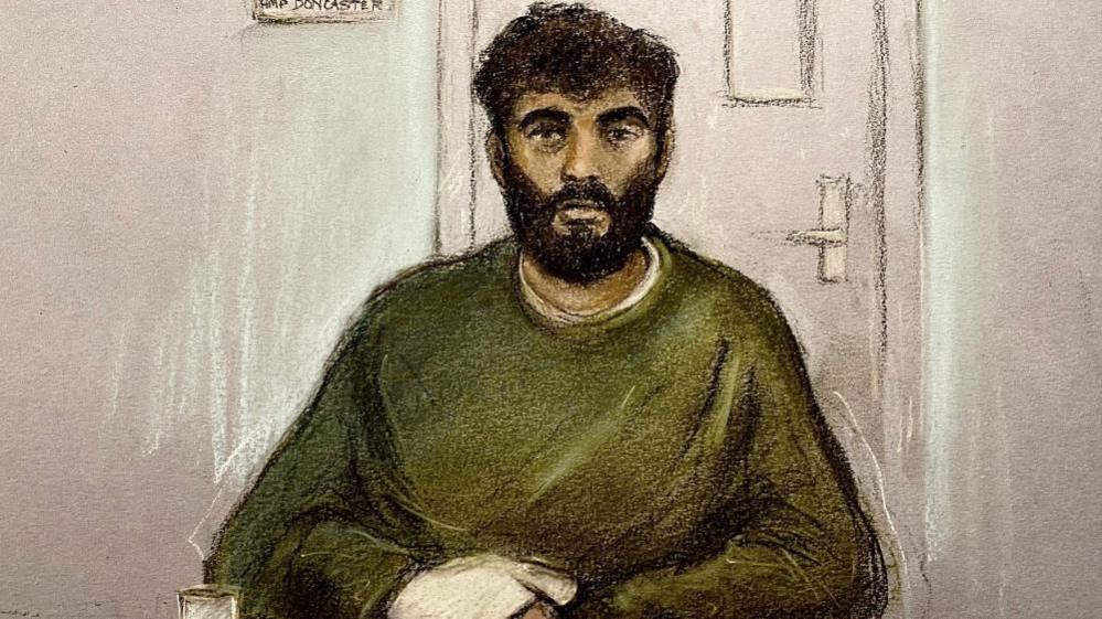 A court sketch of a man with dark hair and beard sits in green jumper