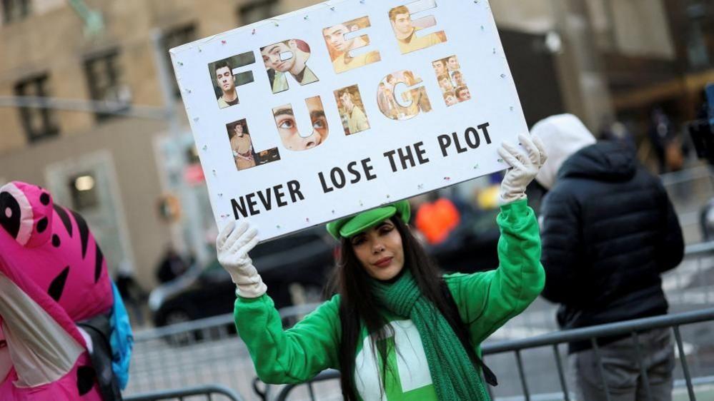 A supporter of Luigi Mangione outside court on 1 December 2025