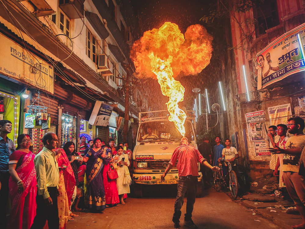 This picture by Ankit Ghosh, who is 16, shows a crowd at the festival of Vijaya Dasami in India, watching a fire-breathing trick. 
