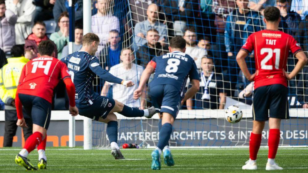 Raith's Jack Hamilton turns home his penalty against Falkirk