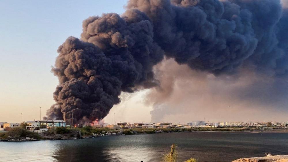 A large plume of smoke rising from fuel depot in Port Sudan