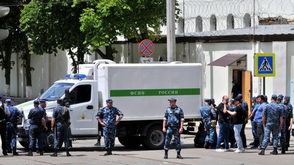 Russian policemen stand guard near a pretrial detention center where inmates had taken FSIN (Federal penitentiary Service) employees hostage in Rostov-on-Don, Russia, 16 June 2024.