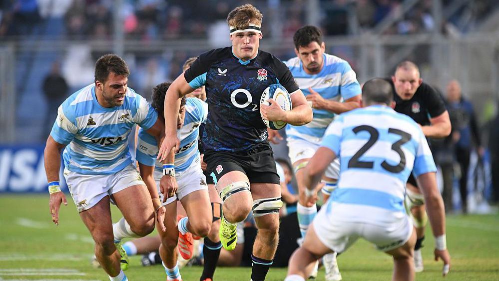 Guy Pepper carries the ball against Argentina