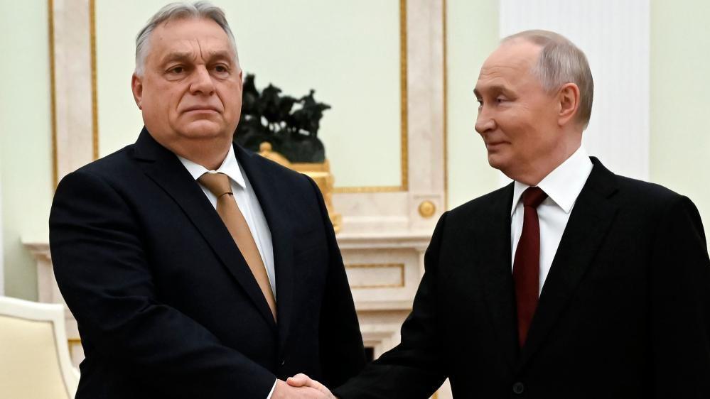Russian President Vladimir Putin (R) and Hungarian Prime Minister Viktor Orban shake hands during a meeting at the Kremlin in Moscow, Russia, 28 November 2025.