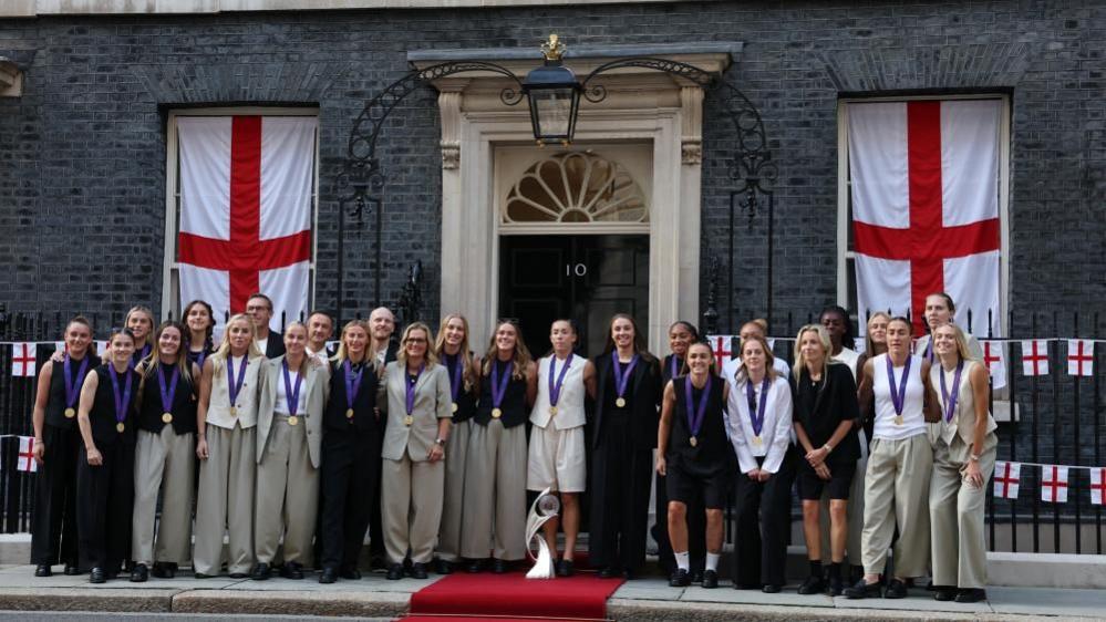 Members of the England women's football team, arrive in Downing Street, London, for a reception at No 10, hosted by Deputy Prime Minister Angela Rayner, in celebration of England's victory over Spain in the UEFA Women's EURO 2025 final in Basel, Switzerland, on Sunday