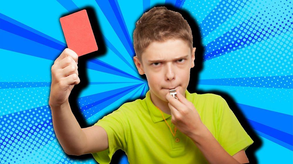 child blowing whistle and holding red card