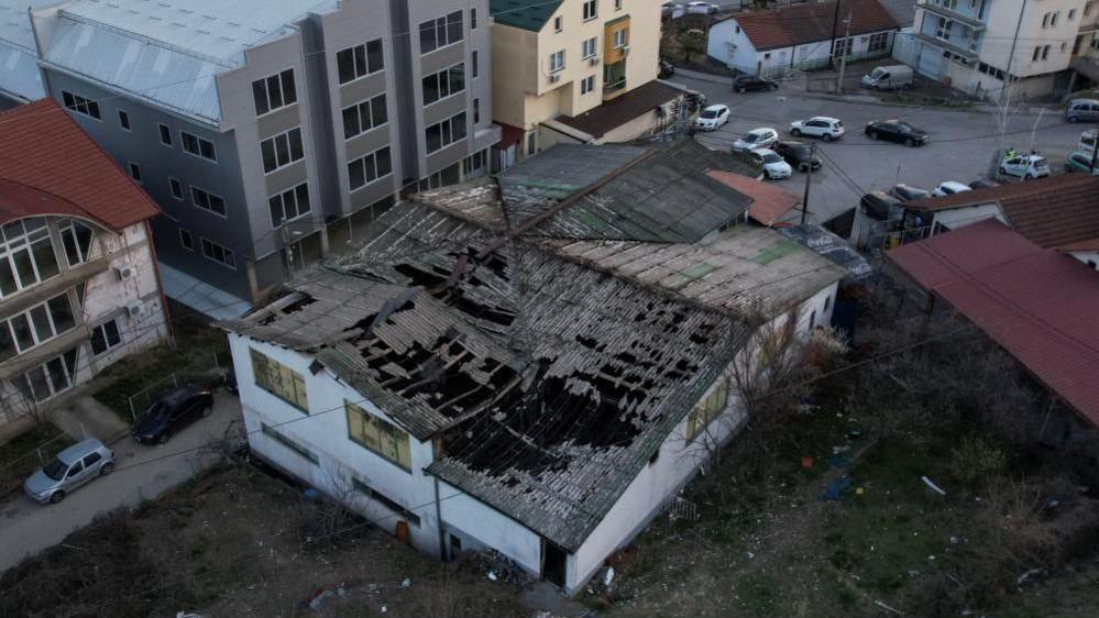 A drone view shows a night club destroyed in a fire resulting in casualties, in the town of Kocani, North Macedonia, March 16, 2025.