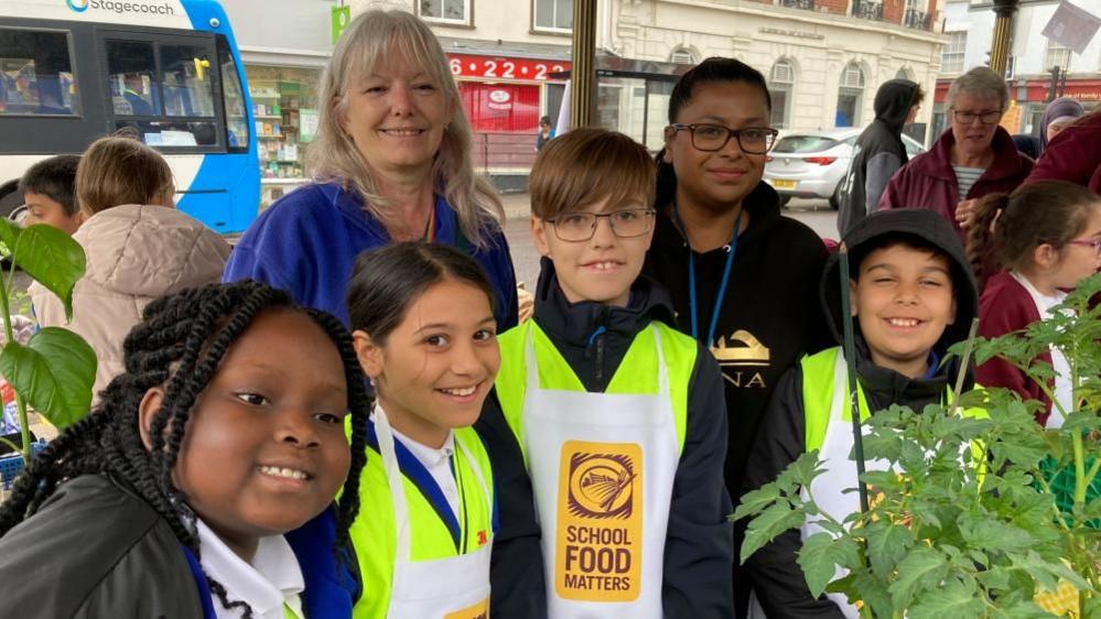 Pupils and teachers from Priory Primary School in Bedford selling items on Bedford Market