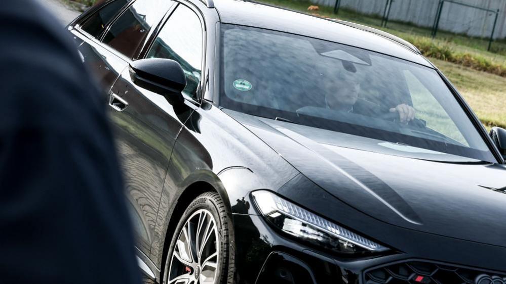 Christian Brückner (not seen) is driven out of Sehnde prison in a black Audi by his lawyer. Photo: 17 September 2025