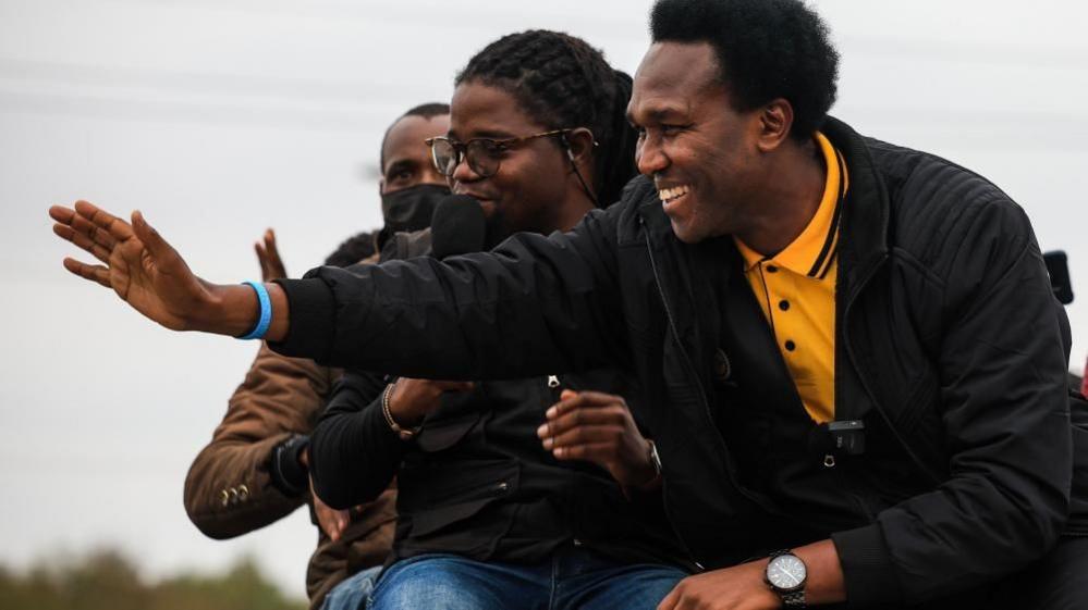 Venâncio Mondlane (R) attends a campaign event in Chimoio, Mozambique - 2 October 2024