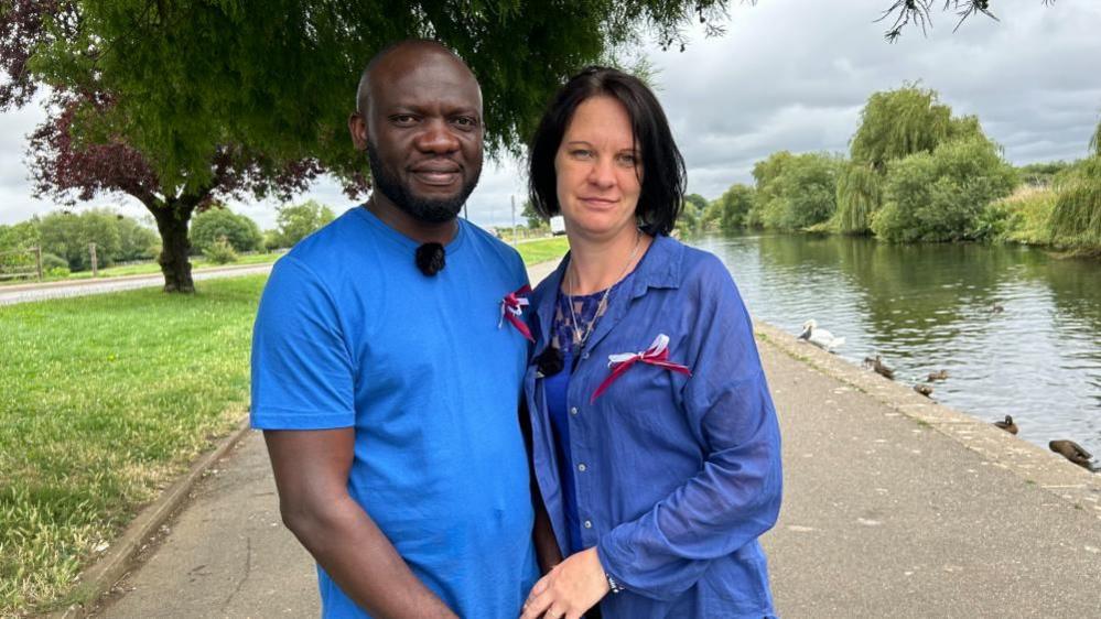 Thomas Okyere and Laura Kirsteine both wearing blue shirts at the embankment