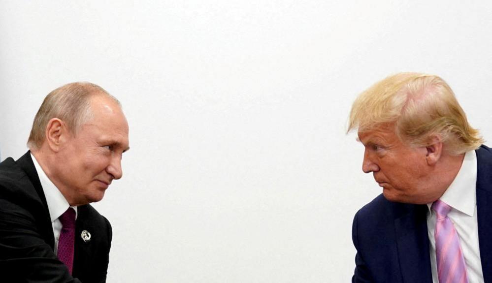 Vladimir Putin and Donald Trump at G20 summit in Japan in 2019