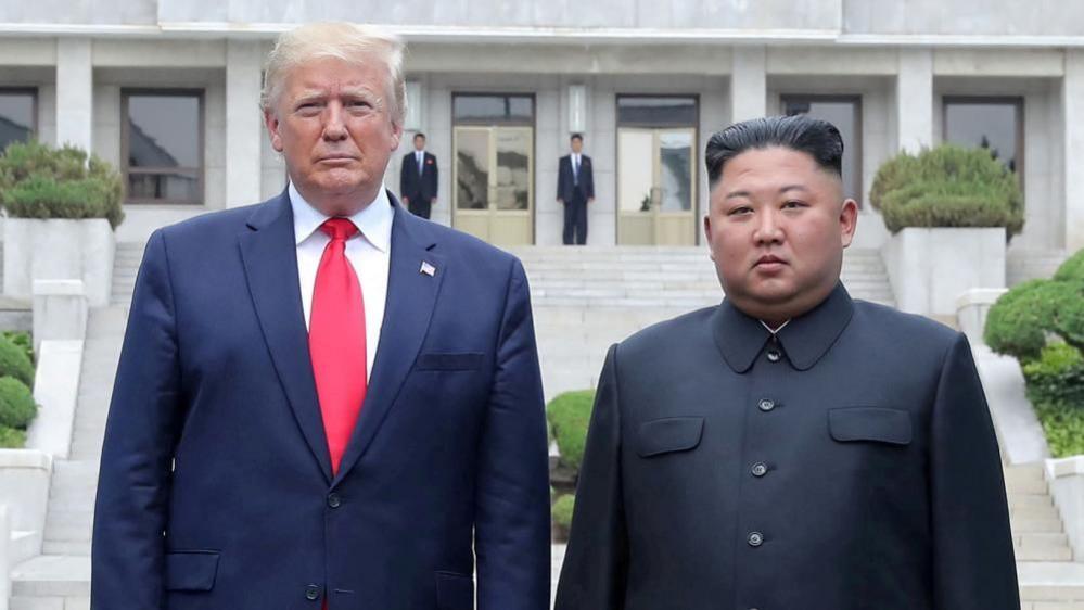 U.S. President Donald Trump and North Korean leader Kim Jong Un pose at a military demarcation line at the demilitarized zone separating the two Koreas in Panmunjom