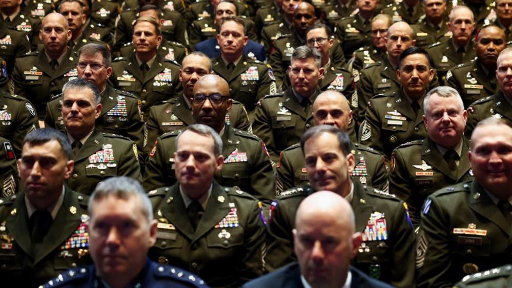 Members of the military attend a meeting convened by US Defence Secretary Pete Hegseth