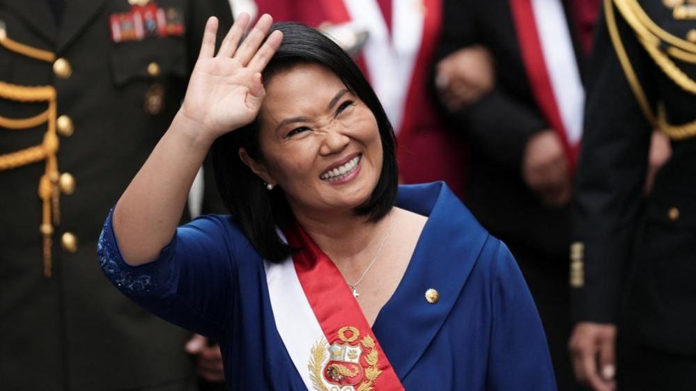 Keiko Fujimori waves after being sworn in Lima as Peru's president. Photo: 28 July 2026.