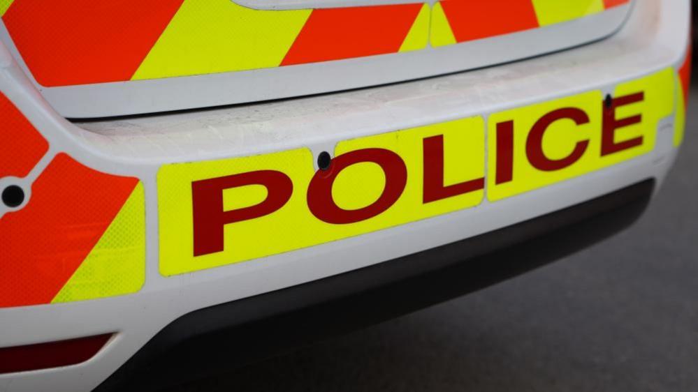 Stock image of the rear of a police car.