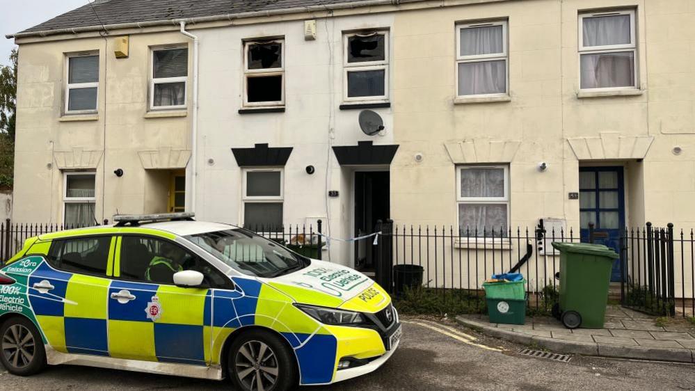 A police car outside a house on Larput Place