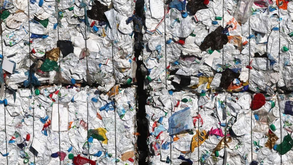 Compressed plastic waste at a recycling plant