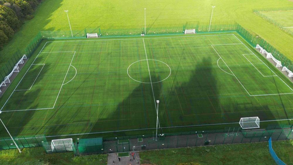 overhead view of 3G floodlit pitch with grass pitches next to it