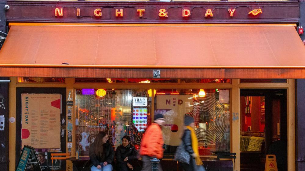 People walking past the Night and Day music venue in Manchester