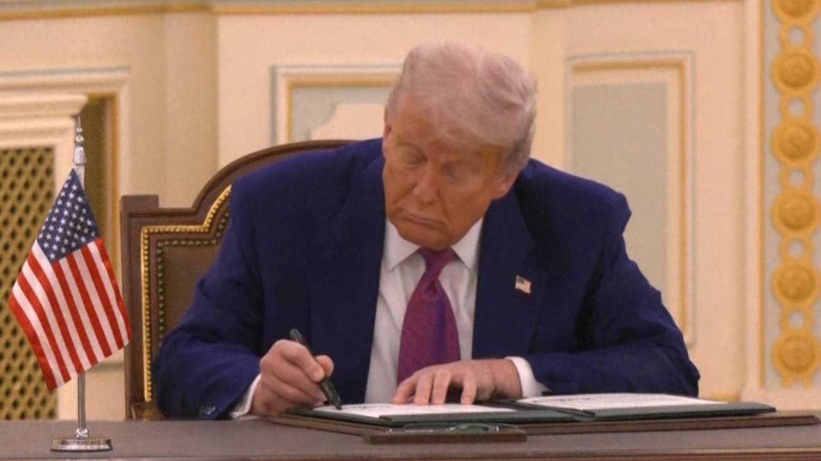 Trump and Saudi crown prince sign partnership on first leg of president's diplomatic tour