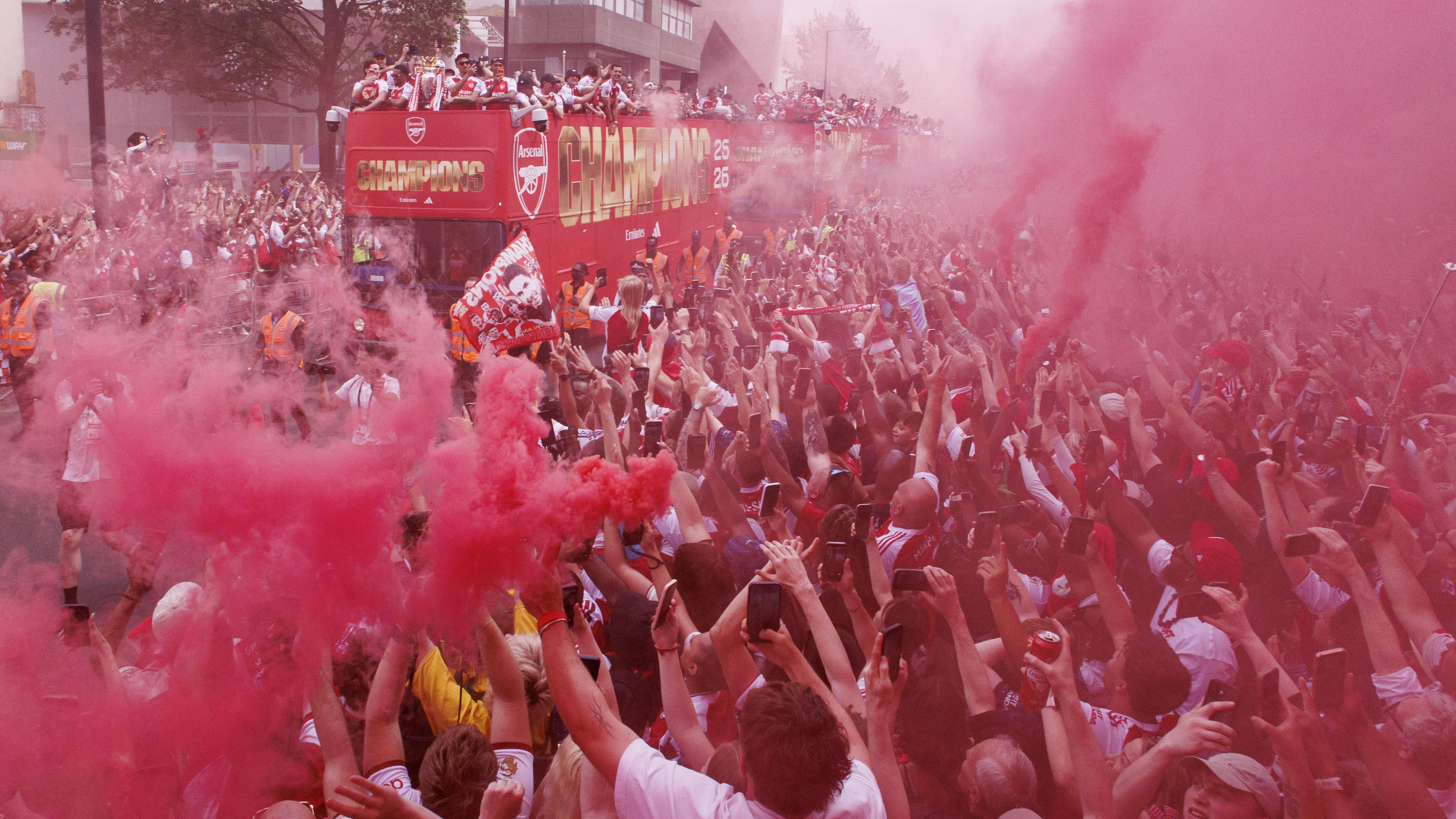 Arsenal fans turn streets red for victory parade