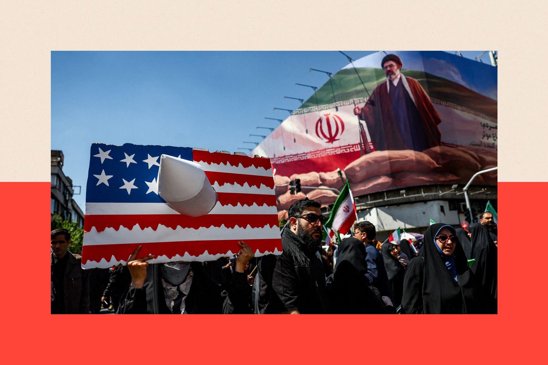 A person holds a placard representing a U.S. flag, with an image of Iran's new Supreme Leader Mojtaba Khamenei on a billboard in the background, on the day of a ceremony marking 40 days since Ayatollah Ali Khamenei was killed.