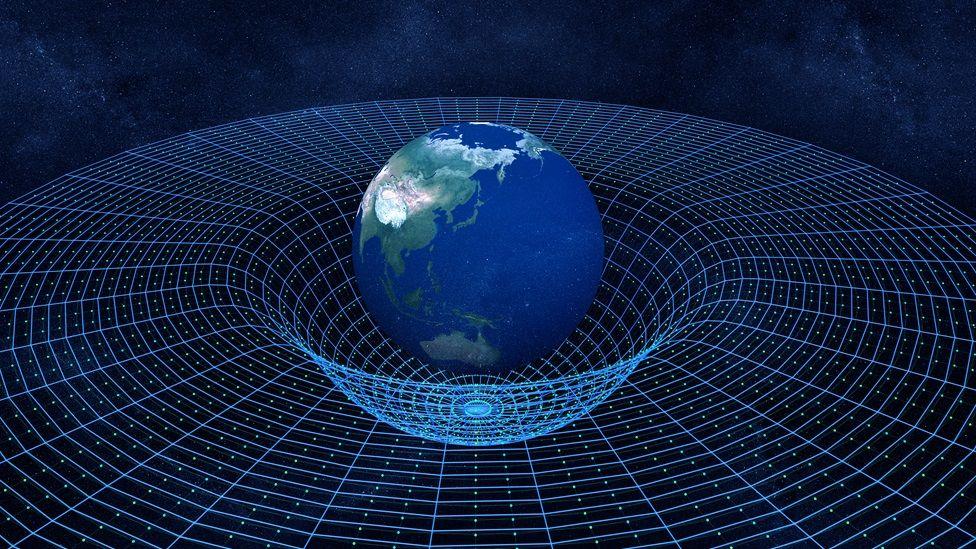 Ilustración del espacio-tiempo de la Teoría de la relatividad de Einstein en la que se ve la Tierra sobre una malla 