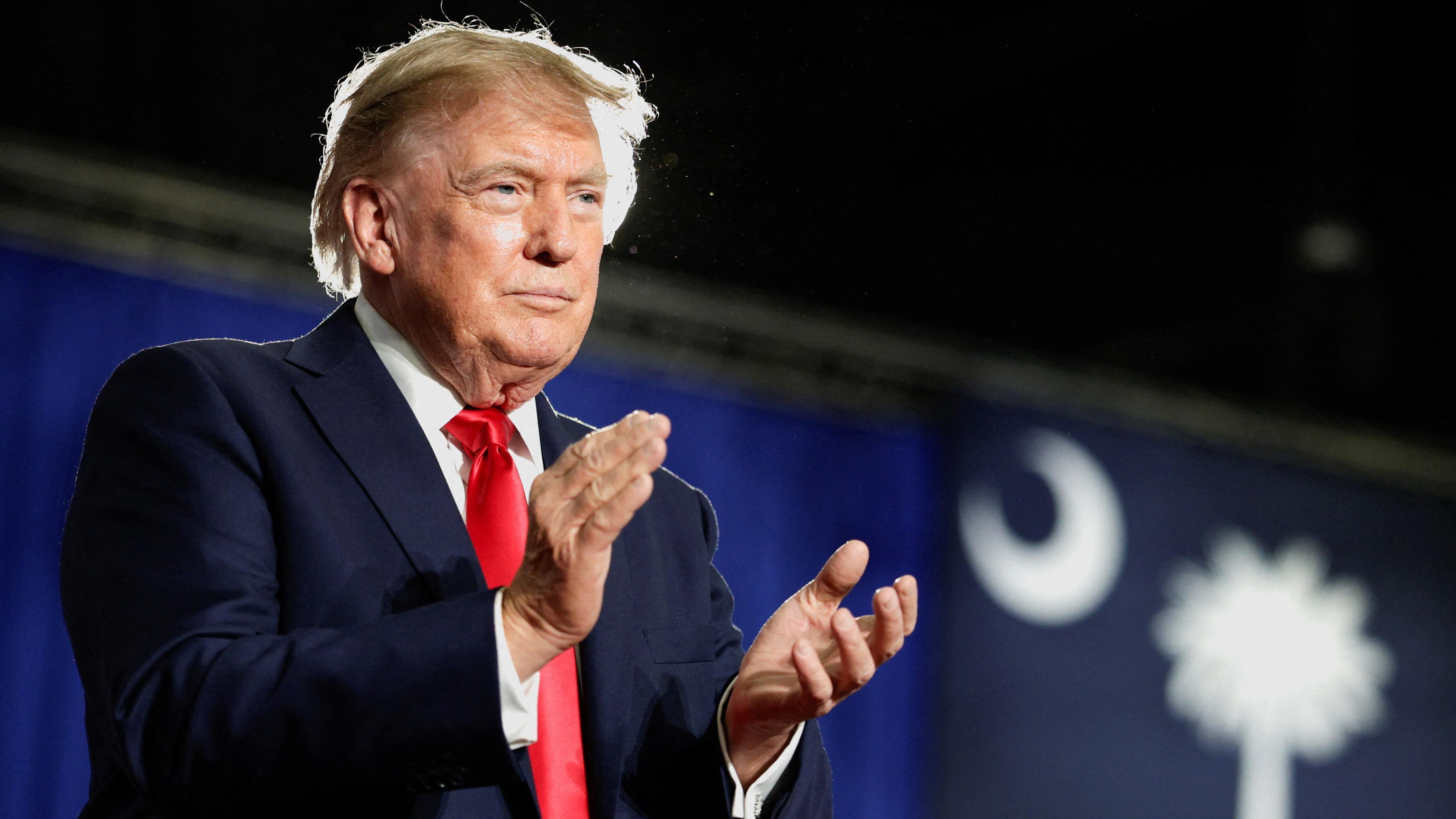 Trump says Canada wants 'benefits' of being US state as Carney says countries in trade war