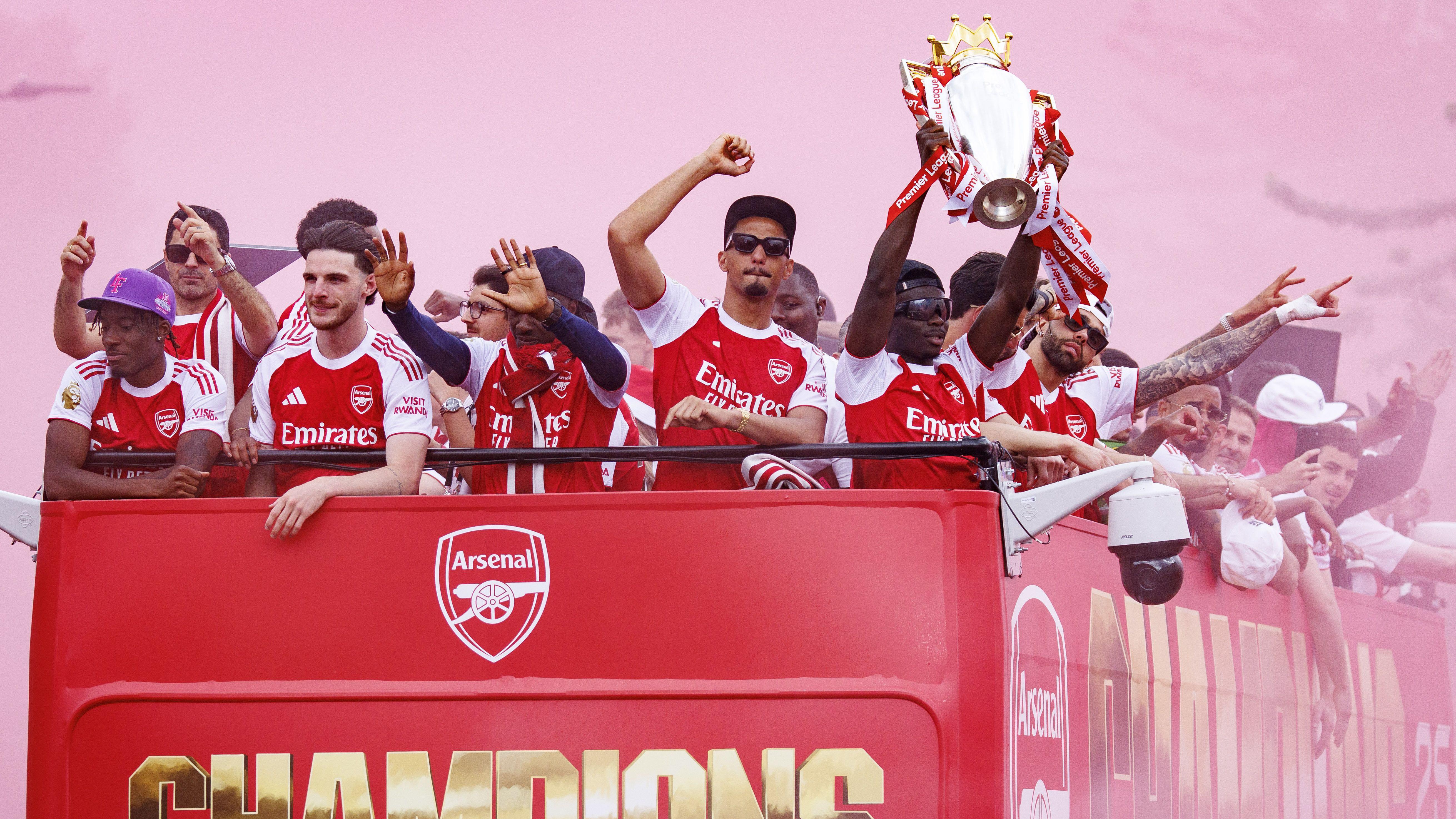 Arsenal fans turn streets red for victory parade