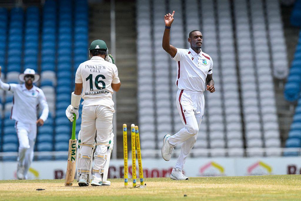 Justin Greaves (R) of West Indies celebrates the dismissal of Mohammad Rizwan (L) of Pakistan during the fourth day of the first Test cricket match between West Indies and Pakistan