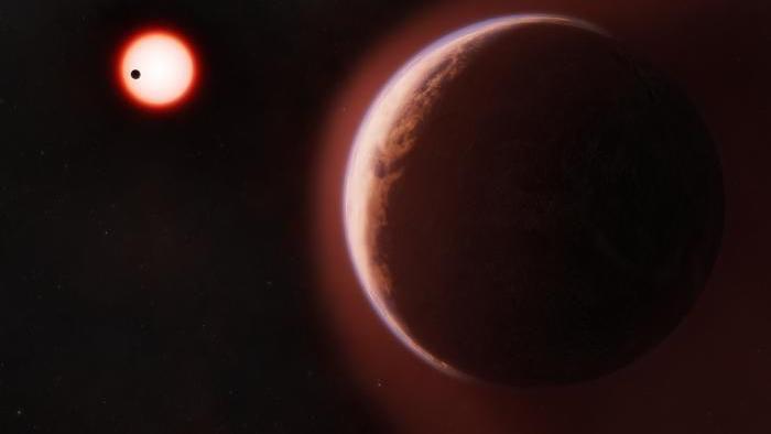 Na ilustraciji crvenkasta nijansa prikazuje atmosferu oko stenovite planete koja kruži oko crvene zvezde
