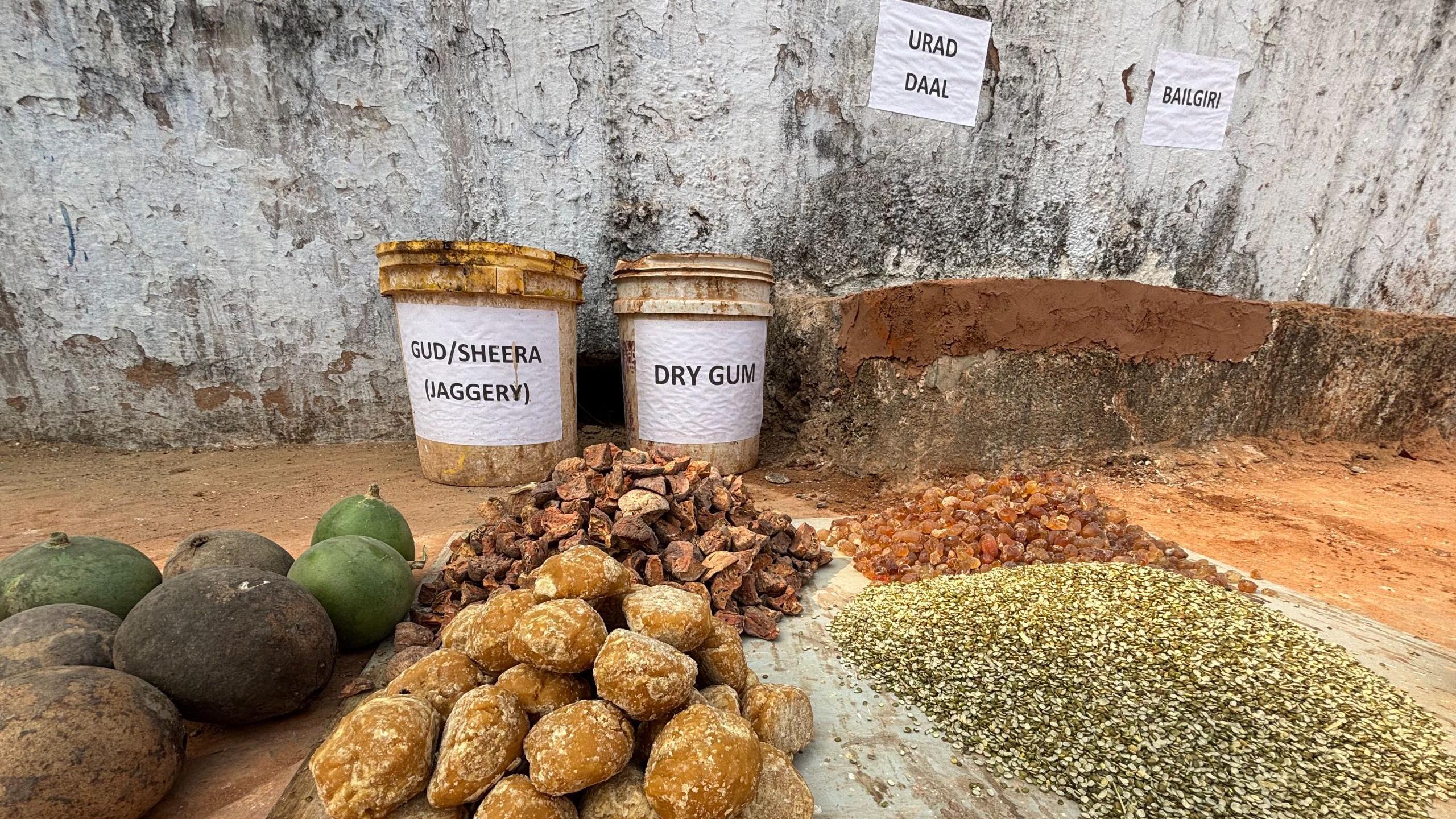 Traditional materials used in conservation including jaggery, urad dal, surkhi, lime, dry gum and bel fruit placed outside the Shahi Bawarchikhana at Chota Imambara in Lucknow.
