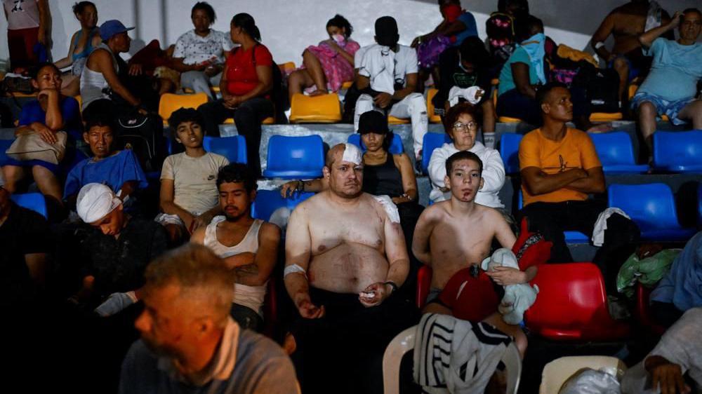 People rest as they receive treatment in a field hospital in the aftermath of earthquakes, in La Guaira, Venezuela