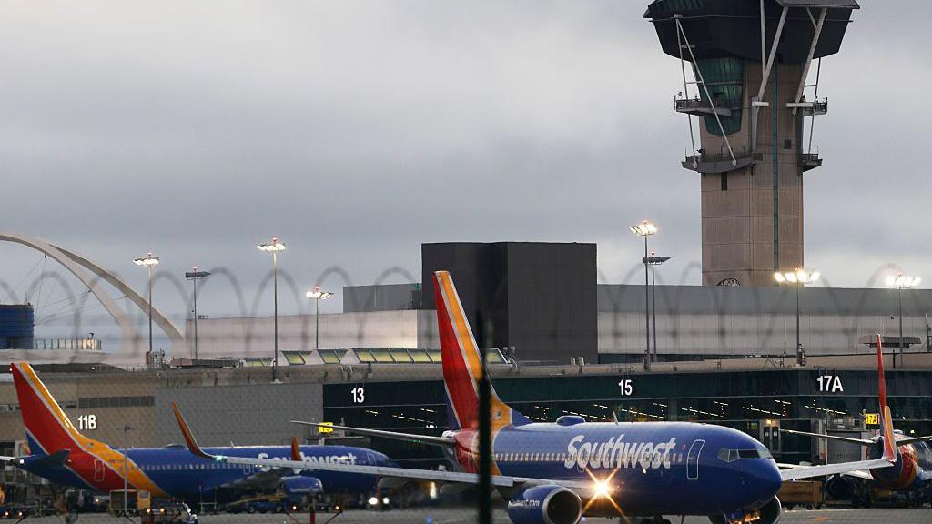 Hundreds of flights cancelled in US as airlines scramble to cut traffic during shutdown