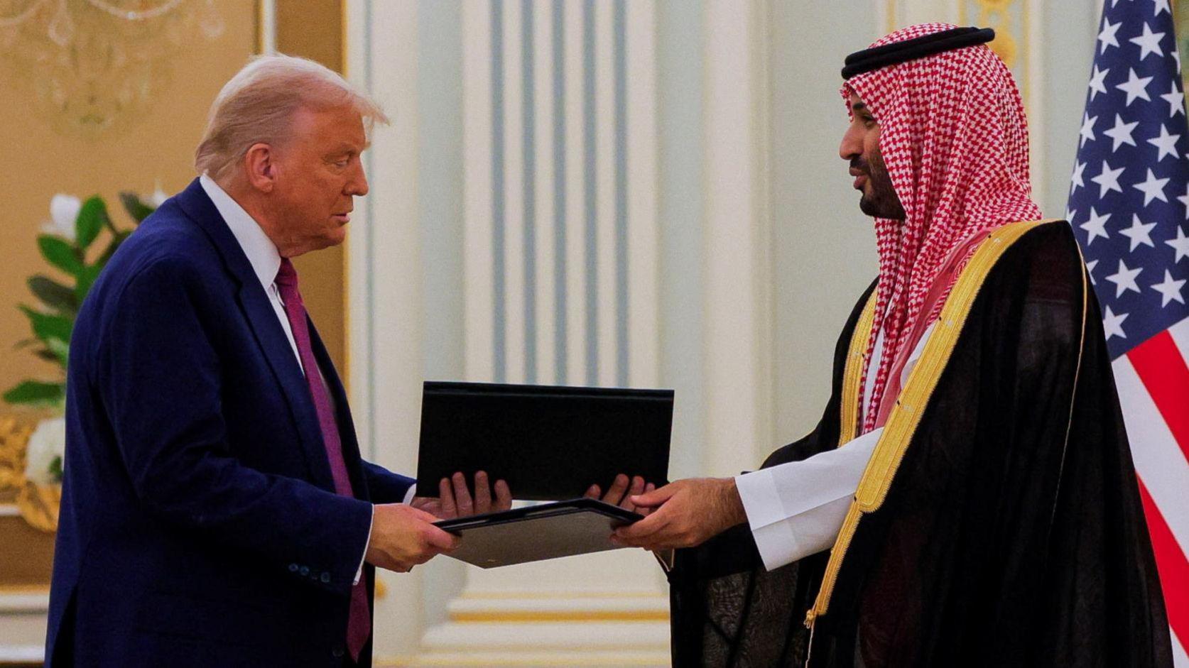 Trump and Saudi crown prince sign partnership on first leg of president's diplomatic tour