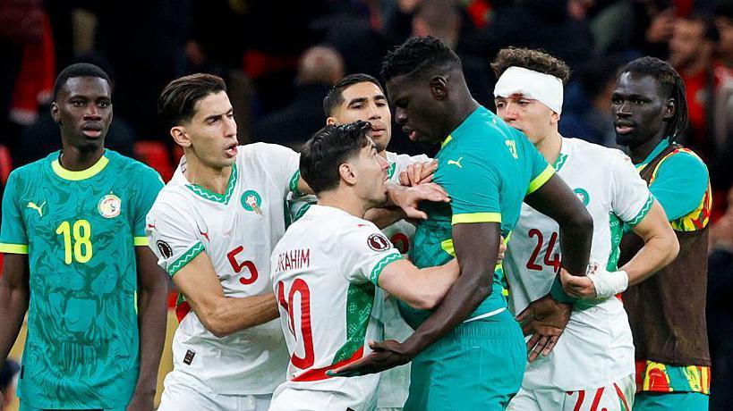 Afcon final: Senegal lead in extra-time after storming off pitch before Morocco miss injury-time penalty 