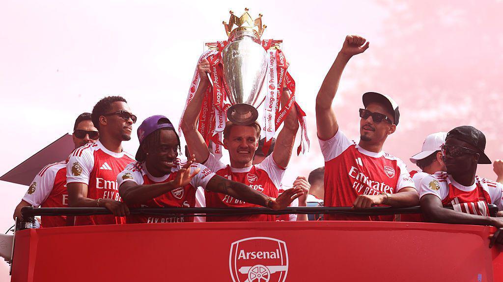 Huge crowds greet Arsenal players as they parade Premier League trophy 